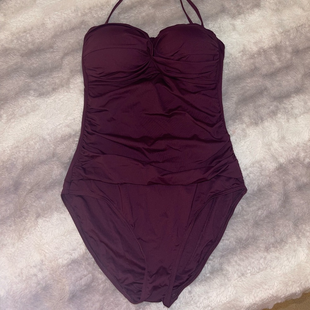 Beautiful eggplant purple and Cole bathing suit with tummy control. Full cover
